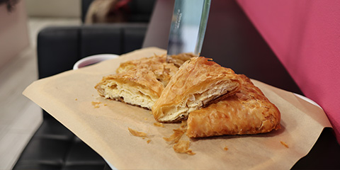 flaky pastry on parchment paper showcasing delicious six layer texture